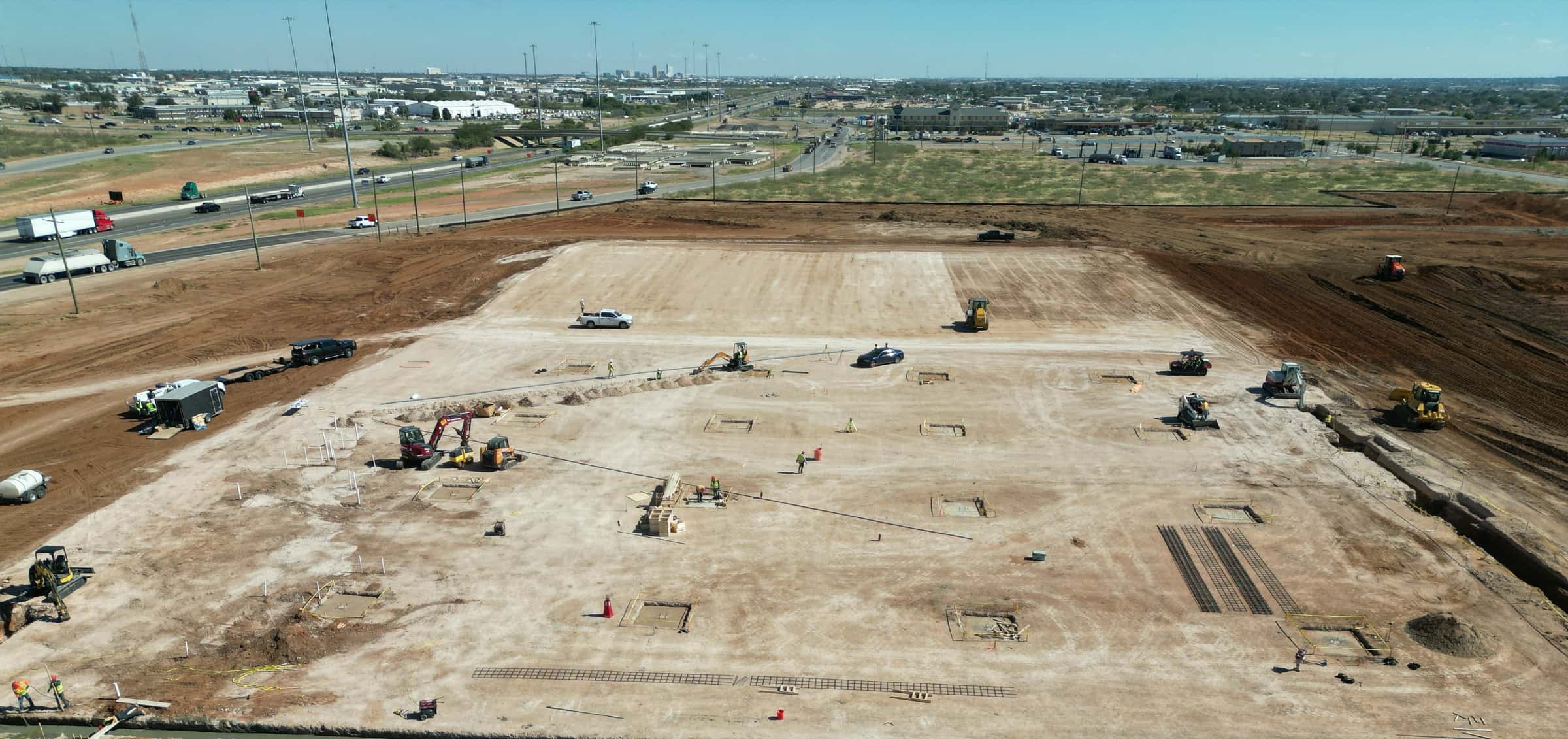 Aerial view of a commercial pad site under construction in the Permian Basin