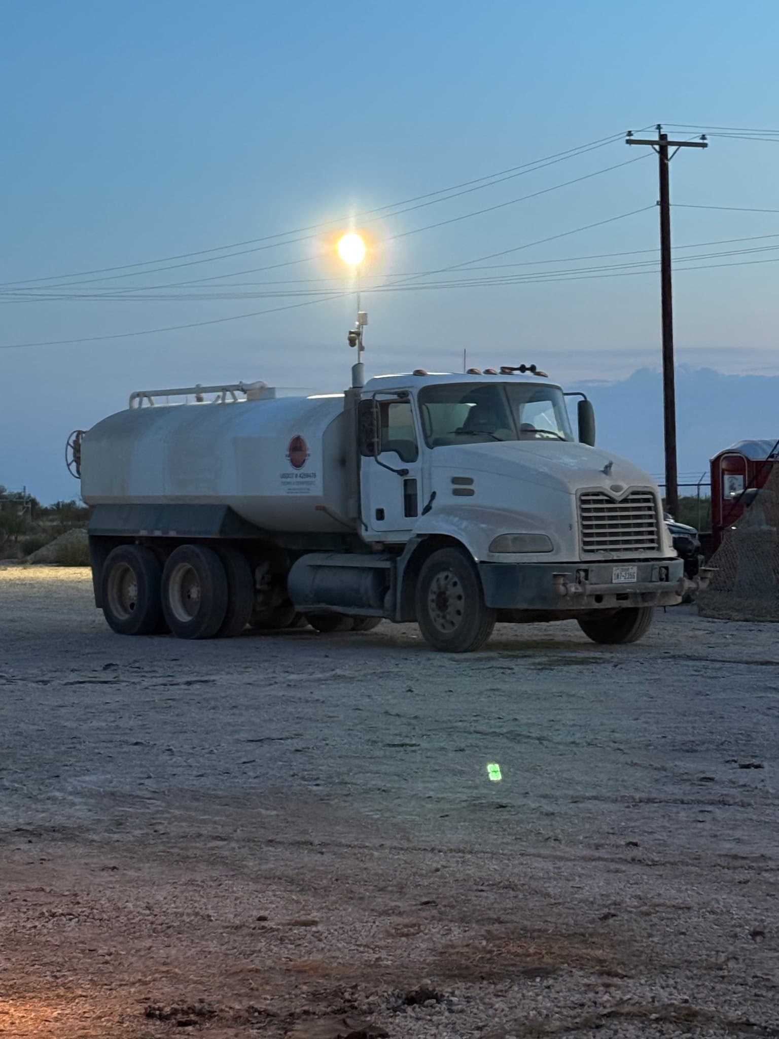 Water truck on site for moisture conditioning ahead of compaction