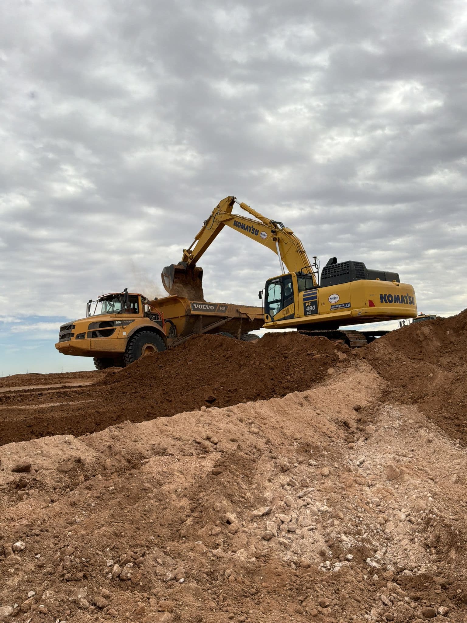 Mass excavation and haul-off underway on a raw commercial tract near Midland, TX