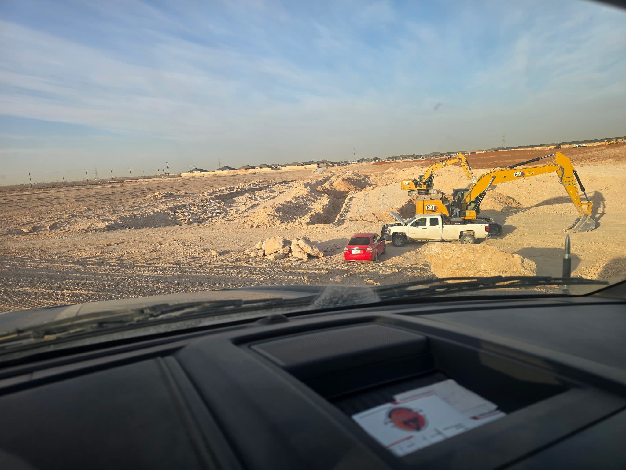 Dozer grading a commercial pad site